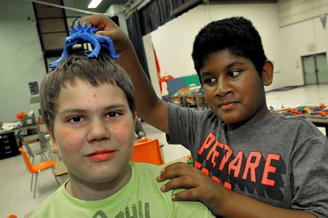 Two children in a PLASP program