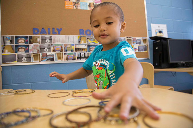 A child in a PLASP program