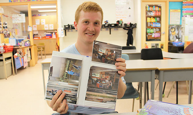 Evan Maltby with a collection of photos