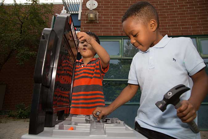 Two builders at a PLASP program