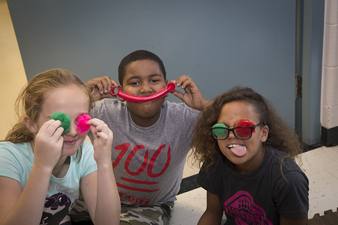 Three children in a PLASP program