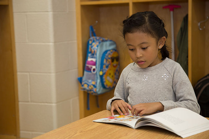 Child reading a book