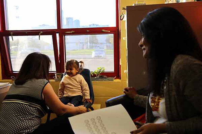 Baby Leila and mom Noreen share a moment at a PLASP program