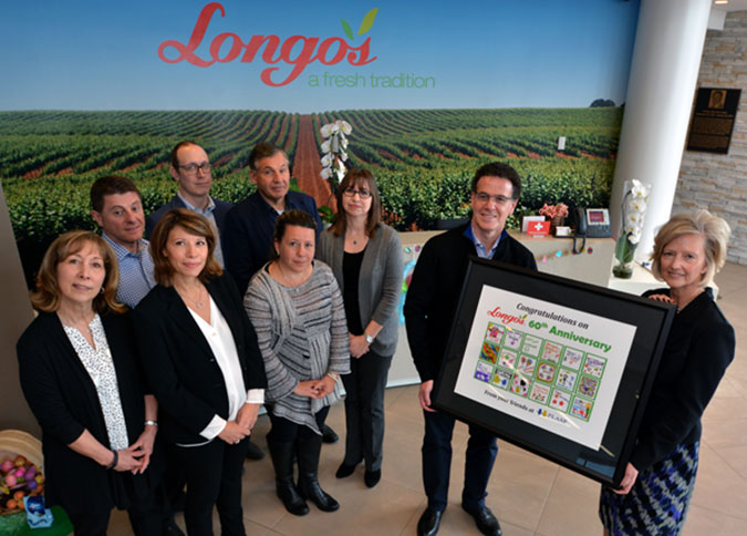PLASP staff present Longo's with a framed picture of children in our programs