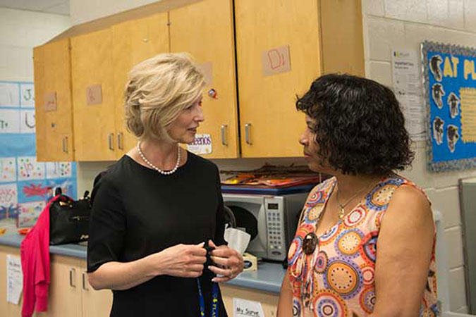 PLASP CEO Lynn Hiebert with Helen Simon