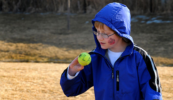 A child with a tennis ball