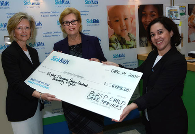 PLASP presents a giant cheque to the SickKids Foundation