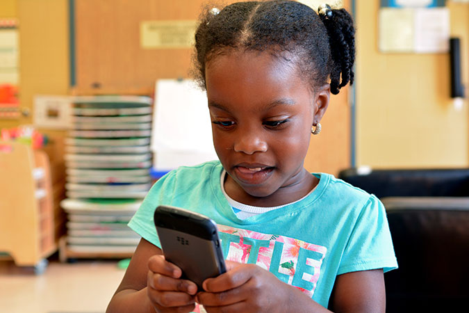 A child with a phone 