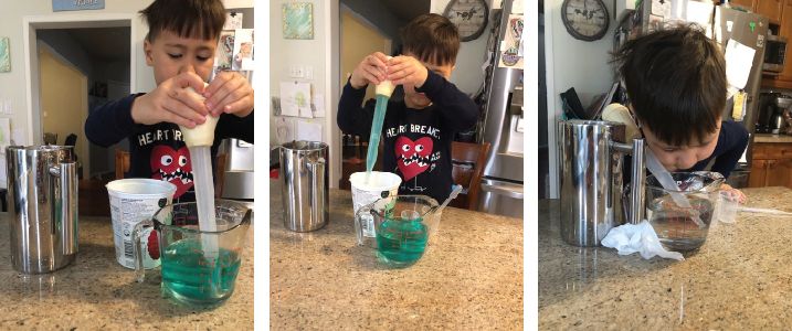 Child using baster to move water
