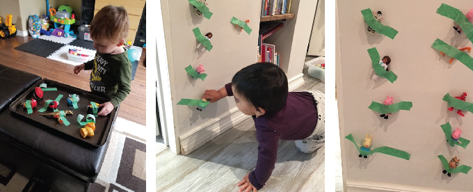 Children removing toys taped to wall and furniture
