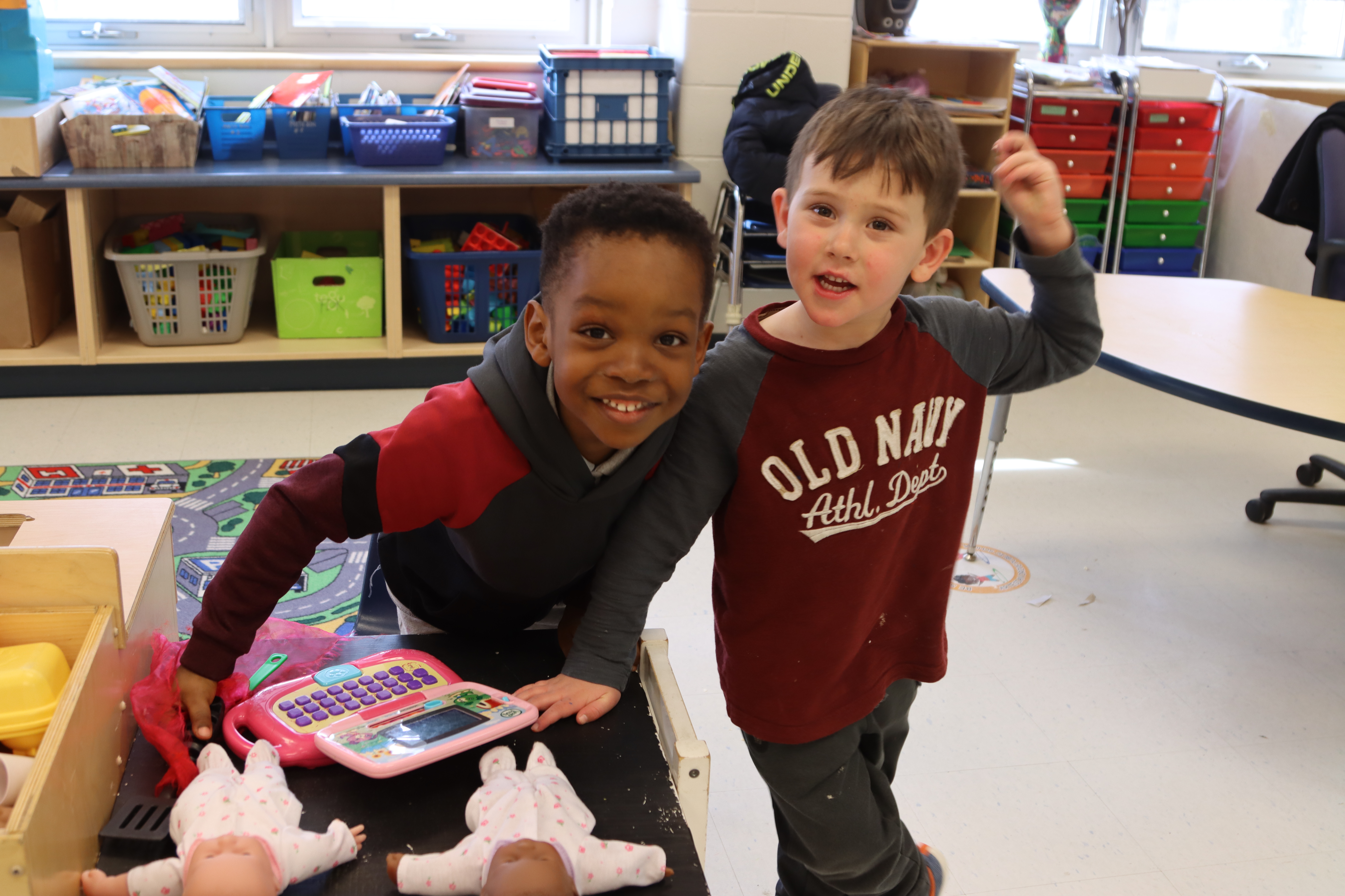 Two friends play together in a PLASP program