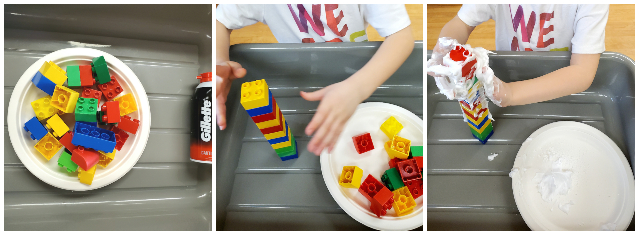 Child rubbing shaving cream on a tower of plastic blocks