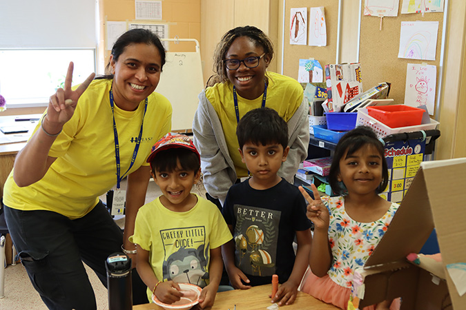 PLASP educators and children smile in a summer program