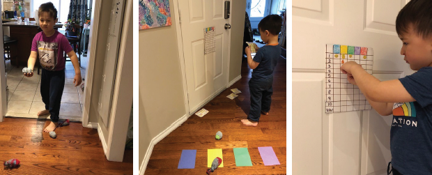 Children throwing bean bags at coloured paper targets